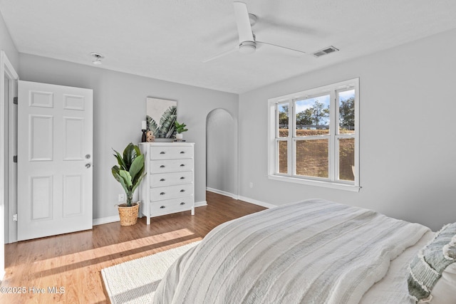 bedroom featuring wood-type flooring and ceiling fan