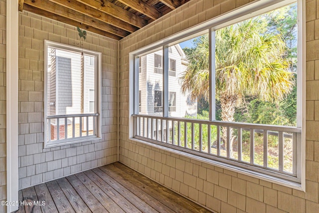 unfurnished sunroom featuring plenty of natural light