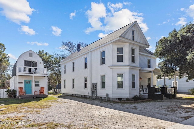 view of front of home with covered porch and a balcony