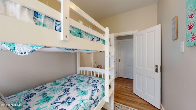 bedroom with hardwood / wood-style flooring