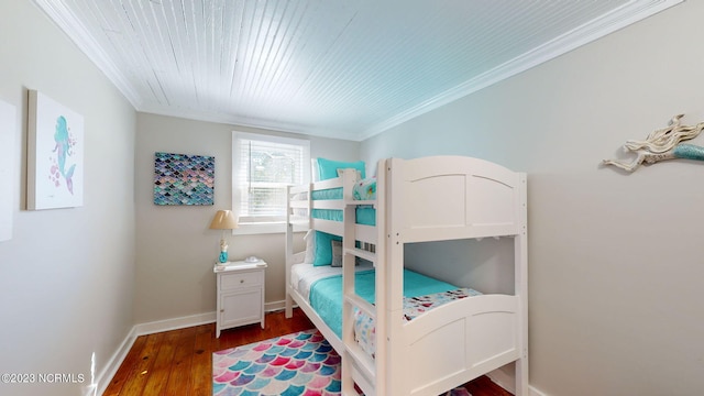 bedroom featuring hardwood / wood-style flooring and ornamental molding