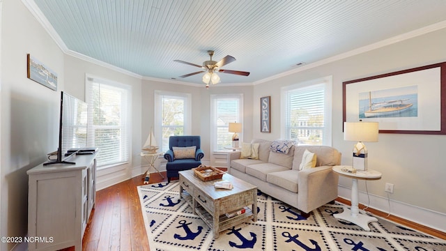 living room with hardwood / wood-style floors, ceiling fan, a healthy amount of sunlight, and ornamental molding