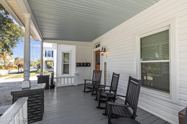 wooden deck featuring covered porch