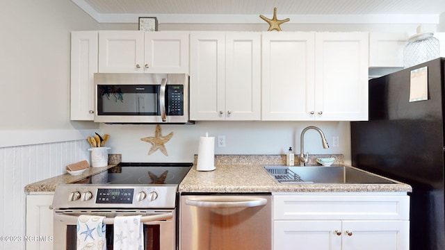 kitchen with white cabinetry, sink, and appliances with stainless steel finishes