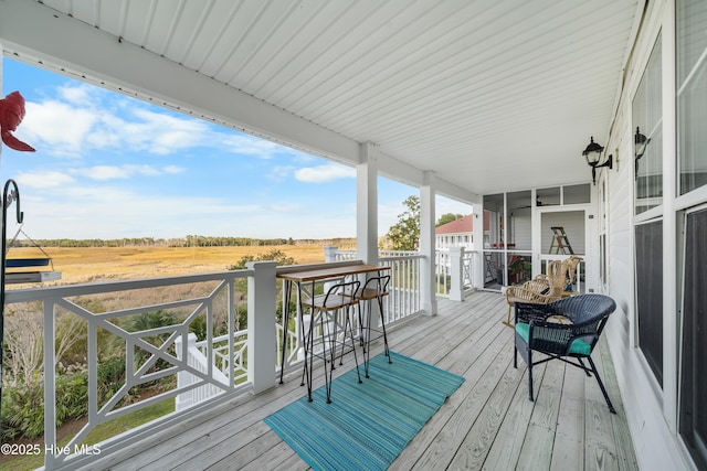 wooden deck featuring a rural view