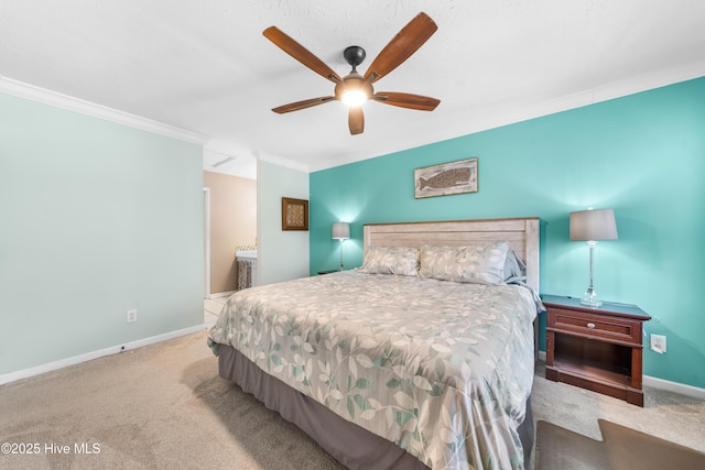 carpeted bedroom with ceiling fan and ornamental molding