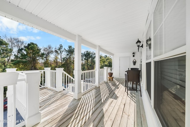 wooden terrace featuring covered porch