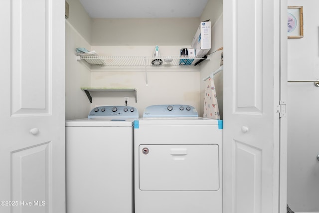 laundry room featuring washing machine and clothes dryer