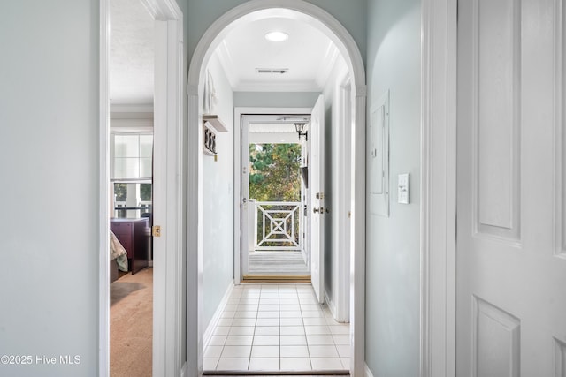 hall with light carpet and ornamental molding