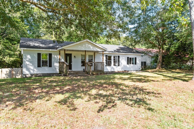 ranch-style house with covered porch and a front lawn