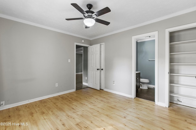 unfurnished bedroom with light wood-type flooring, connected bathroom, ceiling fan, and crown molding