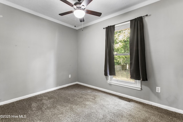 carpeted empty room with a textured ceiling and ceiling fan