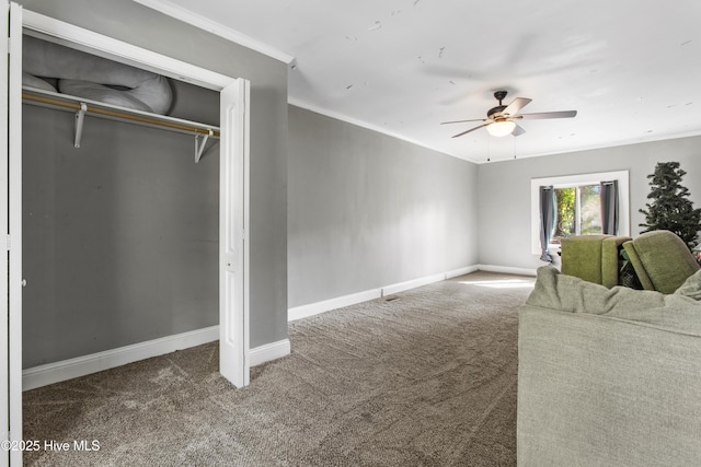 unfurnished living room with carpet floors, ceiling fan, and crown molding