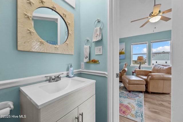 bathroom featuring hardwood / wood-style flooring, vanity, and ceiling fan