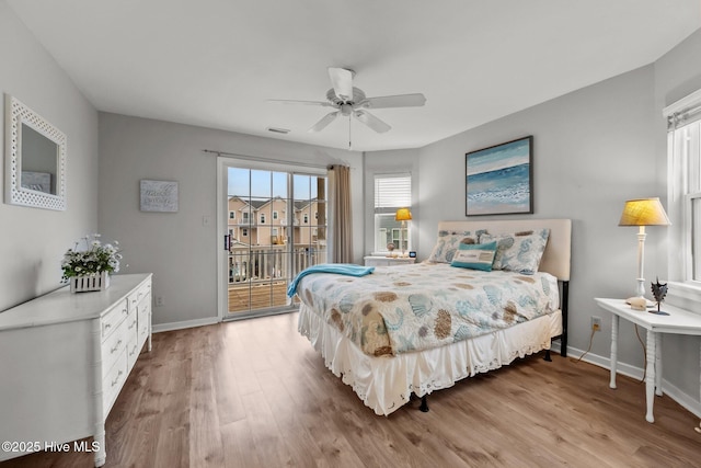 bedroom featuring hardwood / wood-style floors, access to outside, and ceiling fan