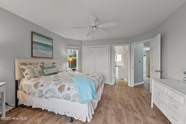 bedroom featuring ceiling fan, light hardwood / wood-style floors, and a closet