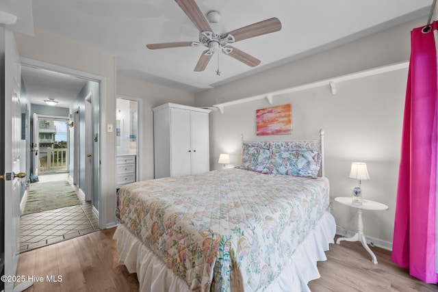 bedroom with connected bathroom, ceiling fan, and light wood-type flooring