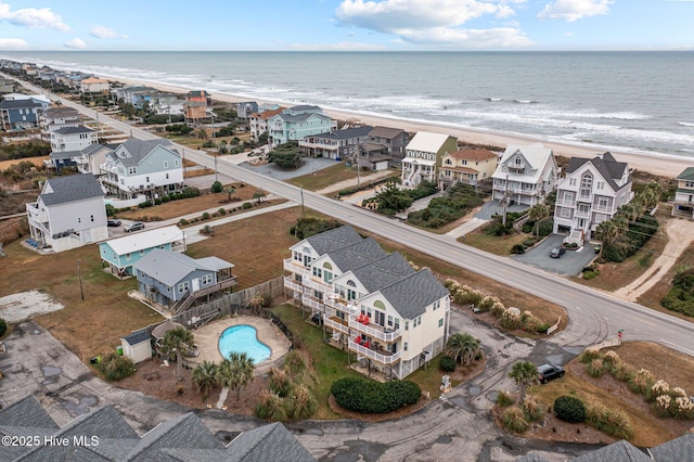 bird's eye view with a water view and a beach view