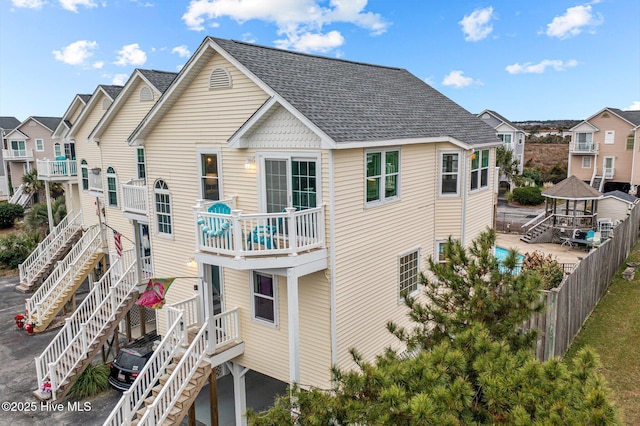 rear view of house with a balcony