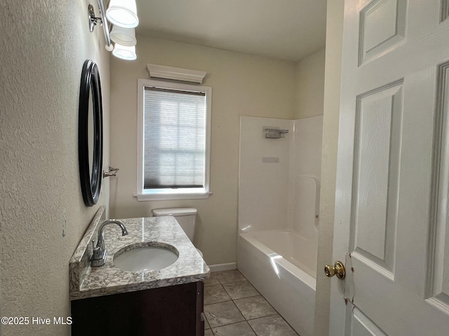 full bathroom with toilet, vanity, tile patterned floors, and washtub / shower combination