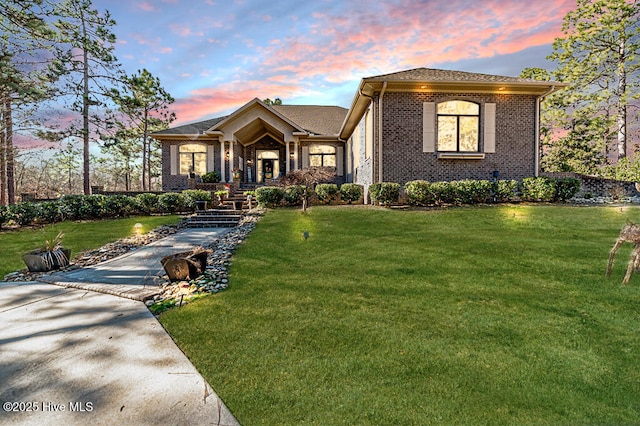 view of front of home with a lawn