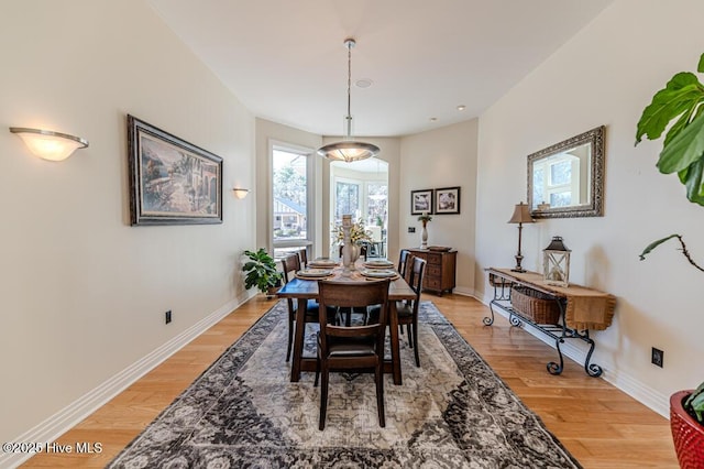 dining area with hardwood / wood-style flooring