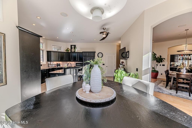 dining room with light hardwood / wood-style flooring and sink