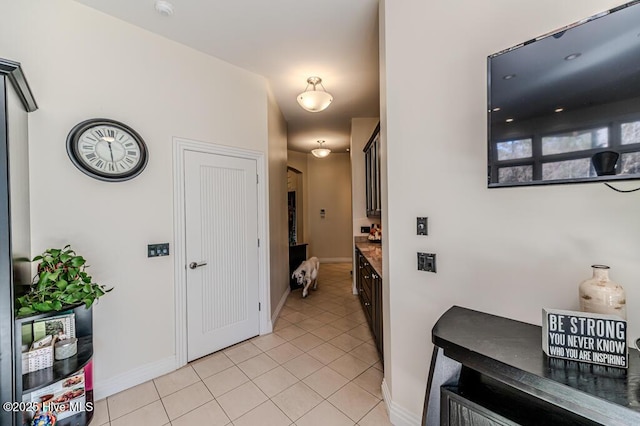 corridor featuring light tile patterned floors