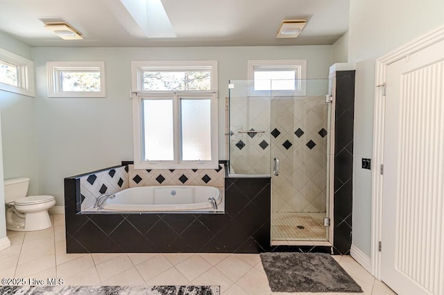 bathroom with tile patterned flooring, a healthy amount of sunlight, and plus walk in shower