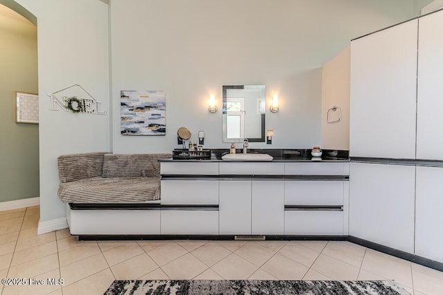 bathroom featuring tile patterned flooring and vanity