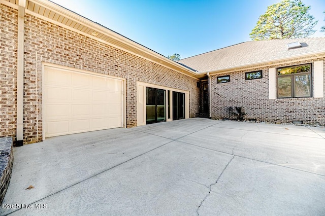 view of patio / terrace featuring a garage