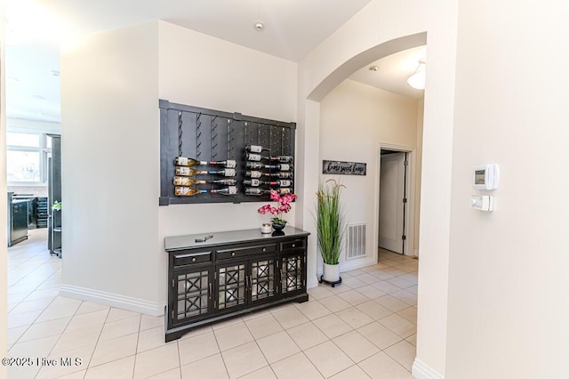 corridor featuring light tile patterned flooring