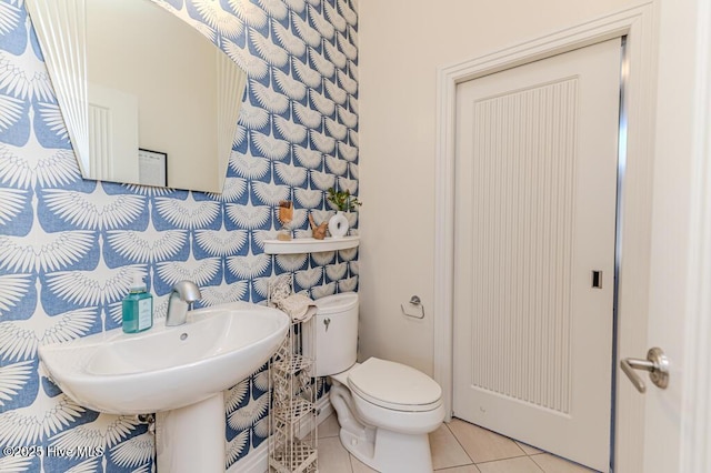 bathroom featuring tile patterned flooring and toilet