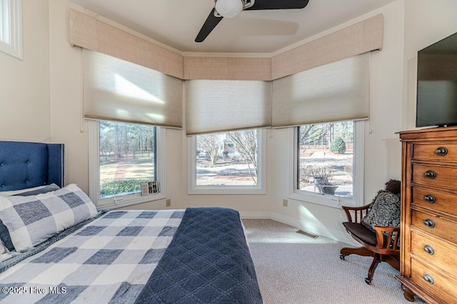 bedroom featuring ceiling fan and carpet