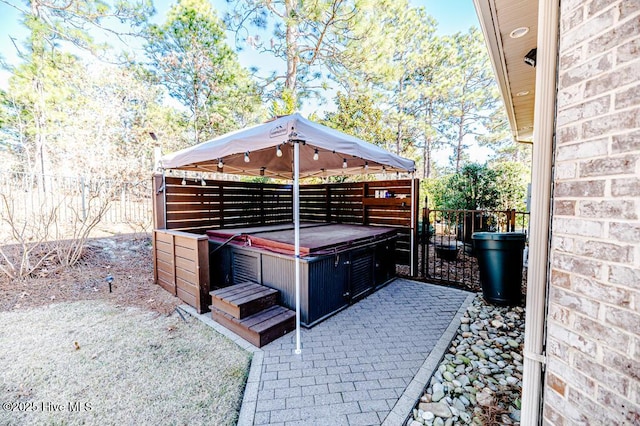 view of patio with a hot tub