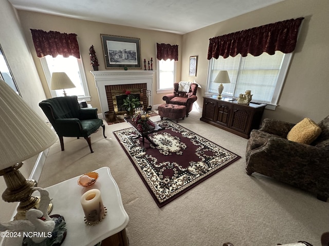 living room with light carpet and a brick fireplace