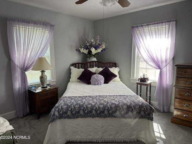 bedroom featuring light carpet and ceiling fan