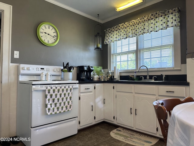 kitchen with white cabinetry, white electric stove, dark tile patterned floors, and ornamental molding