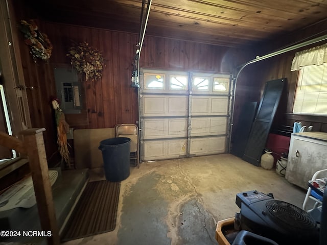 garage with electric panel, wooden walls, and wood ceiling