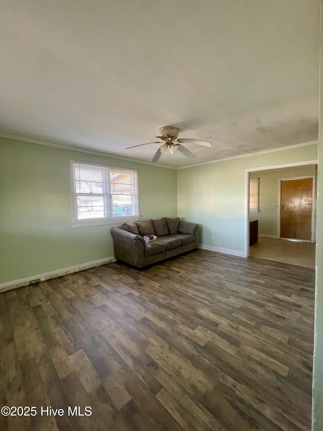 unfurnished living room with dark wood-type flooring, ceiling fan, and ornamental molding