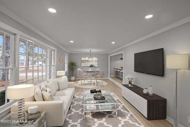 living room featuring crown molding and light wood-type flooring