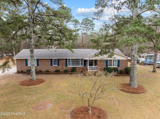 ranch-style home featuring a front yard and a porch