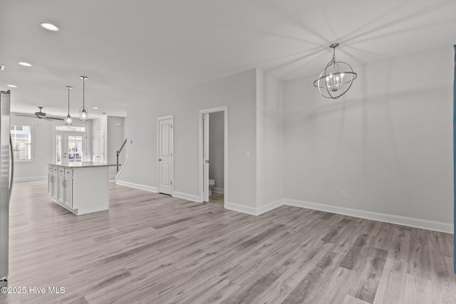 interior space featuring light hardwood / wood-style floors and a chandelier