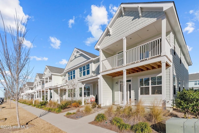 view of front of home with a balcony