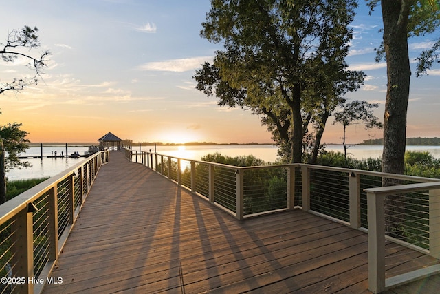 view of dock featuring a water view and a gazebo