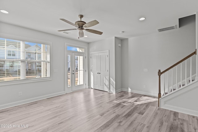 entryway with light hardwood / wood-style floors and ceiling fan