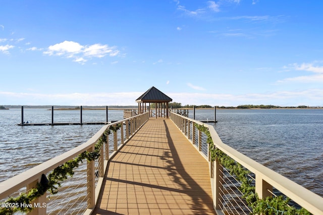 dock area with a gazebo and a water view