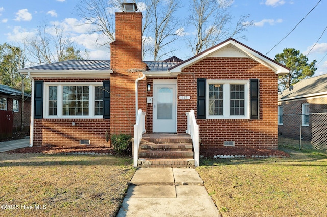 bungalow-style home with a front lawn