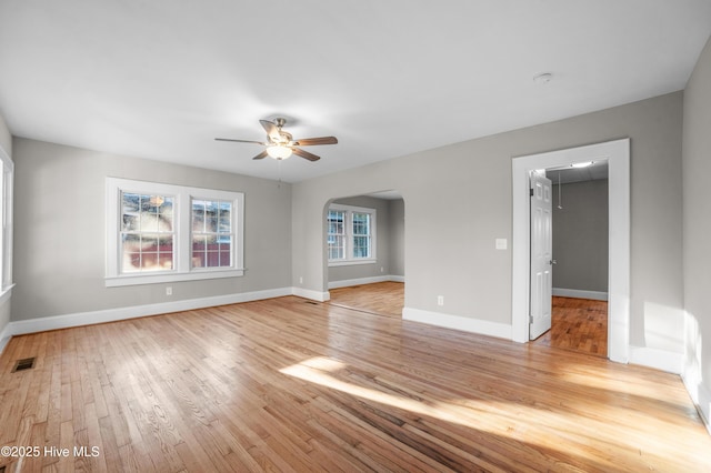 empty room featuring ceiling fan and light wood-type flooring