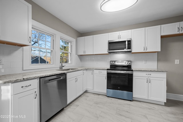 kitchen with white cabinetry and stainless steel appliances